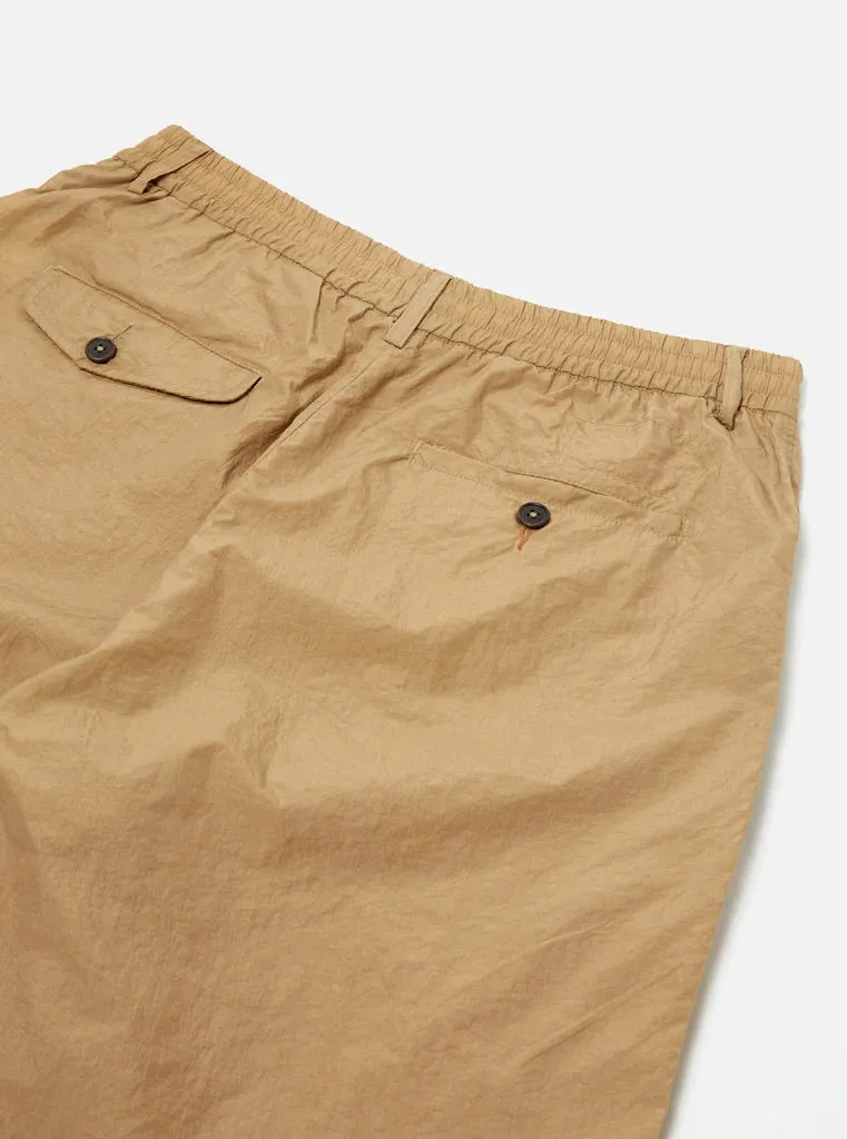 UNIVERSAL WORKS Pleated Track Short In Sand Recycled Nylon Tech